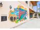 Colorful Venice mural depicting local landmarks at 5826 Harrison Rd, Venice, FL 34293