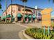 Charming shopping district with various stores and palm trees at 5826 Harrison Rd, Venice, FL 34293