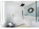 Spa-like shower with marble tile and a rainfall showerhead at 5826 Harrison Rd, Venice, FL 34293