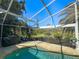 Screened backyard with pool, lush landscaping, and privacy at 3117 Silkwood Ln, Port Charlotte, FL 33953