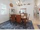 Bright dining room with neutral walls and a decorative chandelier at 3117 Silkwood Ln, Port Charlotte, FL 33953