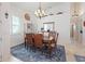 Dining area with a chandelier and access to the entry way at 3117 Silkwood Ln, Port Charlotte, FL 33953
