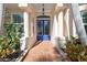 Inviting front entrance showcasing the blue double doors and terracotta tile walkway at 3117 Silkwood Ln, Port Charlotte, FL 33953