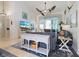 Bright living room featuring a ceiling fan, neutral walls, and view to the outside at 3117 Silkwood Ln, Port Charlotte, FL 33953