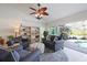 Comfortable living room with seating, decor, and access to the pool deck at 3117 Silkwood Ln, Port Charlotte, FL 33953