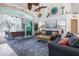 Comfortable living room with stylish decor, couches, and sliding glass doors to the outdoor space at 3117 Silkwood Ln, Port Charlotte, FL 33953