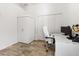 Bright office space with modern furnishings, built in storage and wood-look flooring at 3117 Silkwood Ln, Port Charlotte, FL 33953