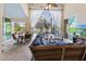 Inviting sunroom with comfortable seating, a ceiling fan, and views of the pool at 3117 Silkwood Ln, Port Charlotte, FL 33953