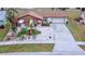 Single-story home with a two-car garage and landscaped yard at 6358 Granger Rd, Port Charlotte, FL 33981
