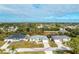 Aerial view of single-story house with attached garage and yard at 10430 Chablis Ave, Englewood, FL 34224