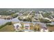 Aerial view of waterfront home community with lush landscaping and canals at 4106 Library St, Port Charlotte, FL 33948