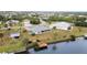 Waterfront property with private dock and lush landscaping at 4106 Library St, Port Charlotte, FL 33948