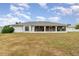 House exterior view and large backyard at 4106 Library St, Port Charlotte, FL 33948