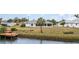 Backyard with canal access and wooden dock at 4106 Library St, Port Charlotte, FL 33948