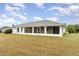 House backyard view with screened porch at 4106 Library St, Port Charlotte, FL 33948