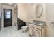 Small bathroom with vintage vanity, toilet, and bathtub at 4106 Library St, Port Charlotte, FL 33948