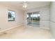 Bedroom with ceiling fan and sliding glass doors at 4106 Library St, Port Charlotte, FL 33948