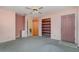 Bedroom with ceiling fan and access to a patio at 4106 Library St, Port Charlotte, FL 33948