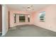 Bedroom with ceiling fan, window seat, and carpeted floors at 4106 Library St, Port Charlotte, FL 33948