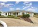 Single story home with landscaped yard and circular driveway at 4106 Library St, Port Charlotte, FL 33948