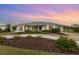 Single-story home with landscaped yard and circular driveway at 4106 Library St, Port Charlotte, FL 33948