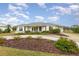 Single story home with a landscaped yard and circular driveway at 4106 Library St, Port Charlotte, FL 33948