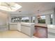 Kitchen boasts island, water views, and hardwood floors at 4106 Library St, Port Charlotte, FL 33948