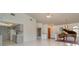 Open living room with views into the kitchen and access to the front door at 4106 Library St, Port Charlotte, FL 33948