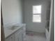 Simple bathroom with single vanity and bathtub at 7351 Lighthouse St, Englewood, FL 34224