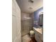 Clean bathroom with shower/tub combo and wood-look flooring at 7472 Stetson Ln, Port Charlotte, FL 33981