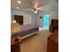 Bright bedroom with double bed, built-in shelving, and en-suite bathroom at 7472 Stetson Ln, Port Charlotte, FL 33981