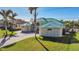 One-story house with green metal roof and paver driveway at 9567 Honeymoon Dr, Port Charlotte, FL 33981