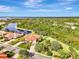 Aerial view showcasing a home's location in a quiet community at 13241 Creekside Ln, Port Charlotte, FL 33953