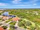 Aerial view of home with water access and lush landscaping at 13241 Creekside Ln, Port Charlotte, FL 33953