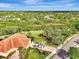 Aerial view of property highlighting its expansive lot and serene surroundings at 13241 Creekside Ln, Port Charlotte, FL 33953