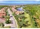 Aerial view of community, showcasing neighborhood homes and landscape at 13241 Creekside Ln, Port Charlotte, FL 33953