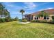 Home with screened patio and lush lawn at 13241 Creekside Ln, Port Charlotte, FL 33953