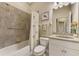 Bathroom with tub, shower, and granite vanity at 13241 Creekside Ln, Port Charlotte, FL 33953