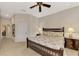 Primary bedroom with king bed, dresser and access to bathroom at 13241 Creekside Ln, Port Charlotte, FL 33953