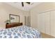 Bedroom with queen bed, dresser, and closet at 13241 Creekside Ln, Port Charlotte, FL 33953