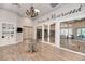 Elegant clubhouse lobby with a grand chandelier and a library at 13241 Creekside Ln, Port Charlotte, FL 33953