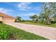 Brick-paved driveway leading to garage and home entrance at 13241 Creekside Ln, Port Charlotte, FL 33953