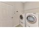 Laundry room with washer, dryer, and shelving at 13241 Creekside Ln, Port Charlotte, FL 33953