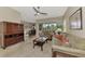 Living room with neutral decor, tiled floors and view to dining area at 13241 Creekside Ln, Port Charlotte, FL 33953