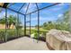 Screened-in patio with golf course and pond view at 13241 Creekside Ln, Port Charlotte, FL 33953