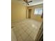 Well-lit bedroom featuring tiled floors and a ceiling fan at 1329 Sheehan Blvd, Port Charlotte, FL 33952