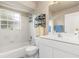 Bathroom with a bathtub, toilet and double sink vanity at 171 Medalist Rd, Rotonda West, FL 33947