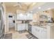 White kitchen with stainless steel appliances and granite countertops at 171 Medalist Rd, Rotonda West, FL 33947