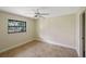 Bedroom with large window and ceiling fan at 2397 Cannolot Blvd, Port Charlotte, FL 33948