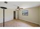 Spacious bedroom with ceiling fan and window at 2397 Cannolot Blvd, Port Charlotte, FL 33948